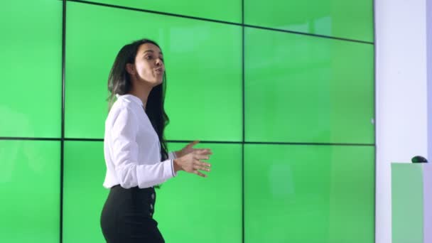 Young Businesswoman Giving Presentation Interacting Green Screen Video Wall — Stock Video