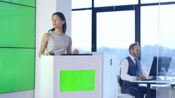 Young Businesswoman Giving Presentation Interacting Green Screen Video Wall — Stock Video