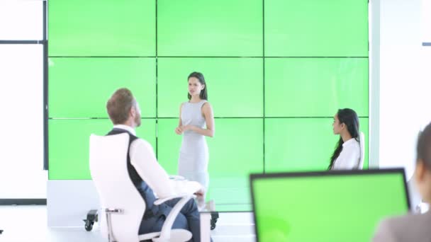 Young Businesswoman Giving Presentation Interacting Green Screen Video Wall — Stock Video