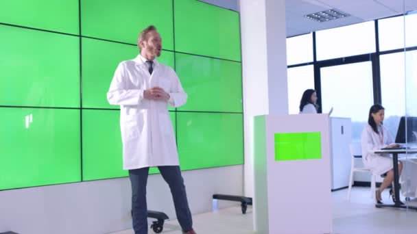 Medical Service Adviser Giving Presentation Interacting Green Screen Video Wall — Stock Video