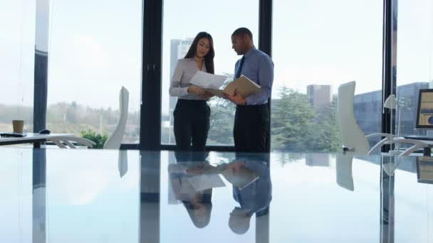 Business Man Woman Discussing Paperwork Front Large Office Window — Stock Video