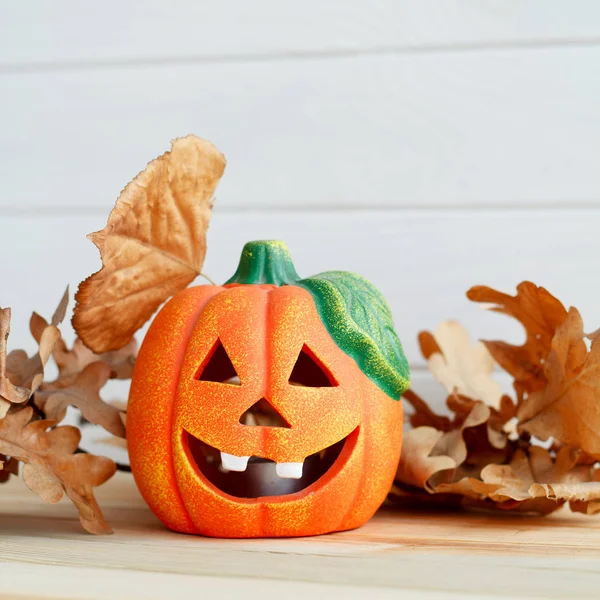 Picture of pumpkie over white wooden background. Halloween conce — Stock Photo, Image