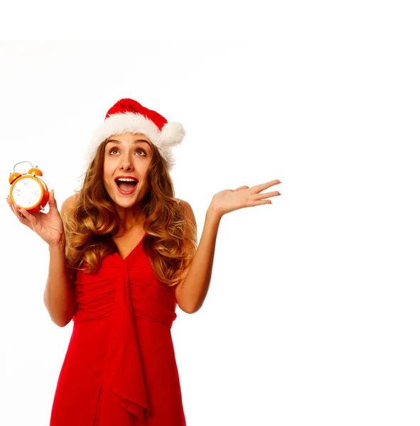 Portrait of a beautiful woman with christmas hat holding clock i — Stock Photo, Image