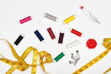 Sewing supplies and accessories isolated on white.