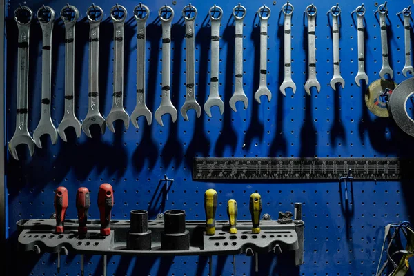 Stand with various tools in a car workshop.