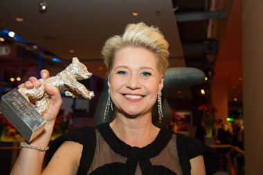 BERLIN, GERMANY - FEBRUARY 20: Danish actress Trine Dyrholm, winner of the Silver Bear for Best Actress, poses with her award after the closing ceremony of the 66th Berlinale International Film Festival on February 20, 2016 in Berlin, Germany. 