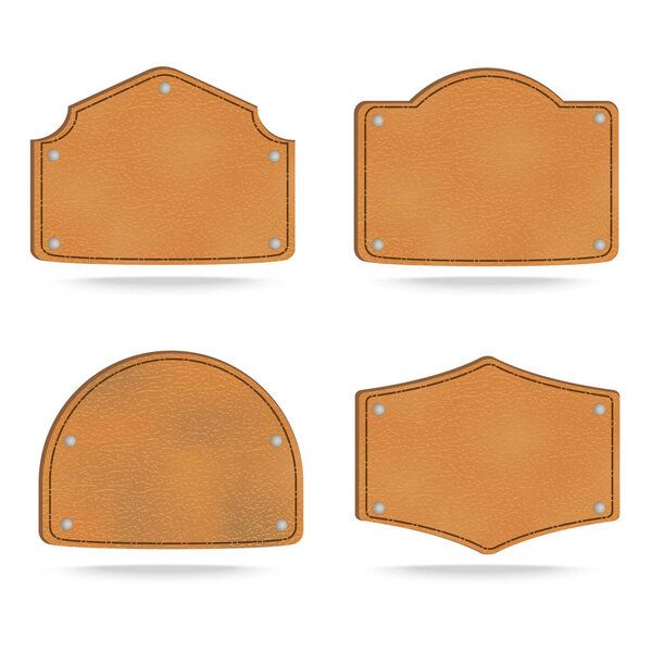 Set of leather tag labels on white