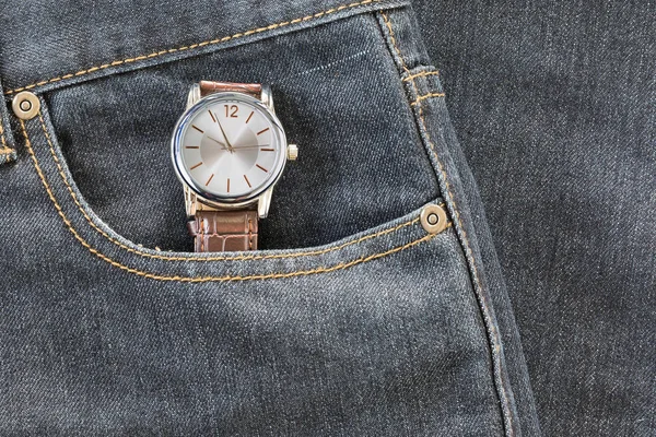 Wristwatch in denim jeans pocket — Stock Photo, Image