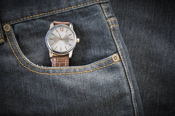 Wristwatch in denim jeans pocket — Stock Photo, Image