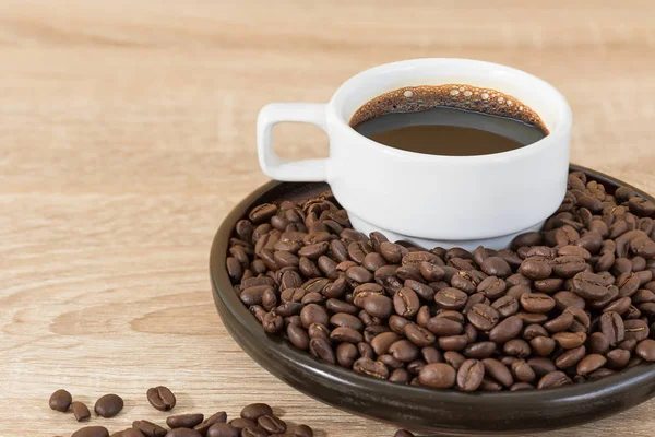 Coffee beans and coffee cup — Stock Photo, Image