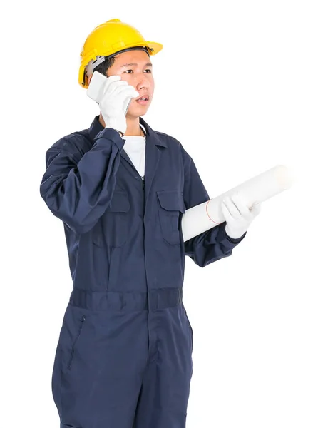 Worker holding blueprint and used smartphone — Stock Photo, Image