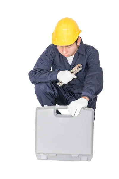 Young handyman sitting with his tool box — Stock Photo, Image