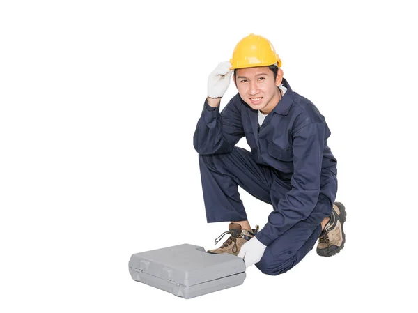 Young handyman sitting with his tool box — Stock Photo, Image