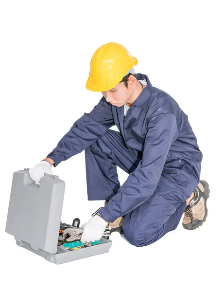 Young handyman sitting with his tool box — Stock Photo, Image