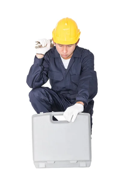 Young handyman sitting with his tool box — Stock Photo, Image