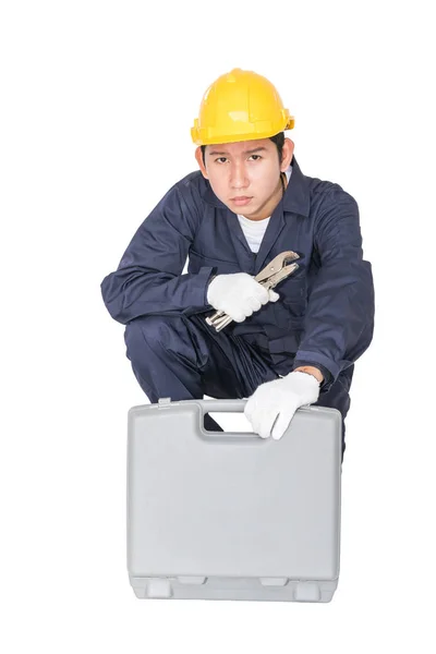 Young handyman sitting with his tool box — Stock Photo, Image