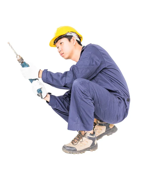 Handyman em unifrom sentado com sua broca elétrica — Fotografia de Stock