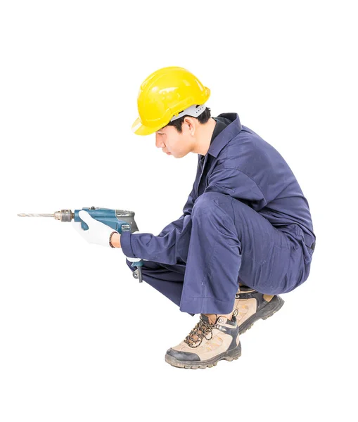 Handyman em unifrom sentado com sua broca elétrica — Fotografia de Stock