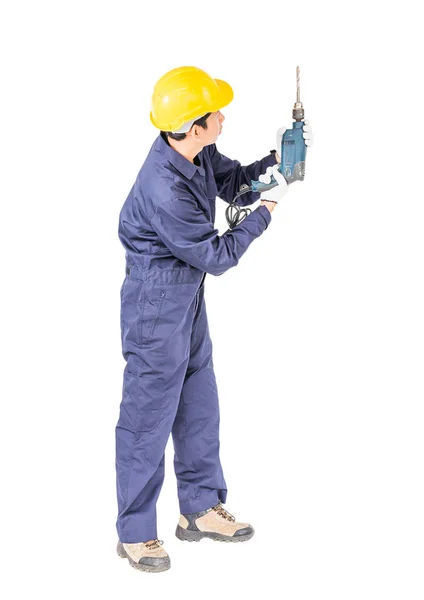 Handyman em unifrom pé com sua broca elétrica — Fotografia de Stock