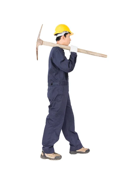 Man in uniform hold old pick mattock that is a mining device — Stock Photo, Image