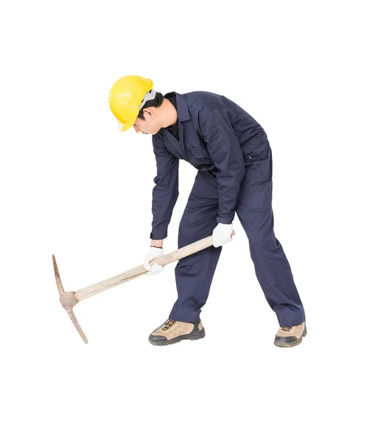 Man in uniform hold old pick mattock that is a mining device — Stock Photo, Image