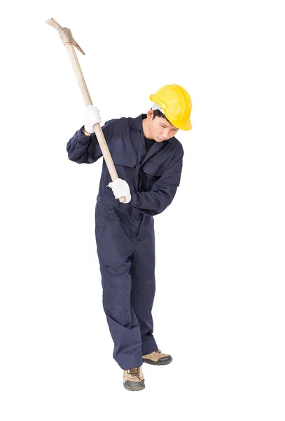 Man in uniform hold old pick mattock that is a mining device — Stock Photo, Image