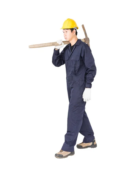 Man in uniform hold old pick mattock that is a mining device — Stock Photo, Image