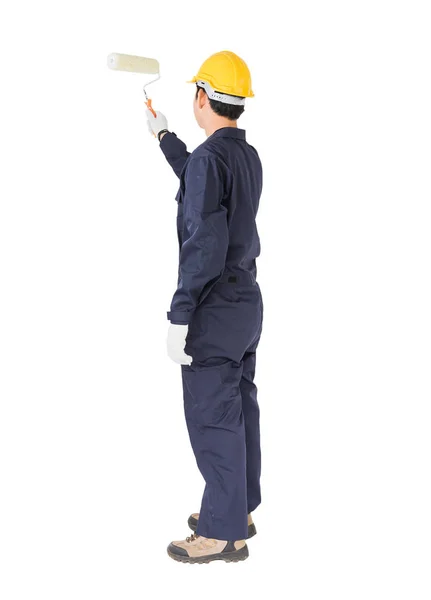 Lavoratore in uniforme utilizzando un rullo di vernice è pittura invisibile f — Foto Stock