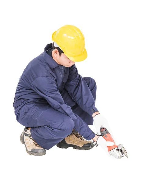 Junge Handwerker in Uniform halten Schleifer in der Hand — Stockfoto