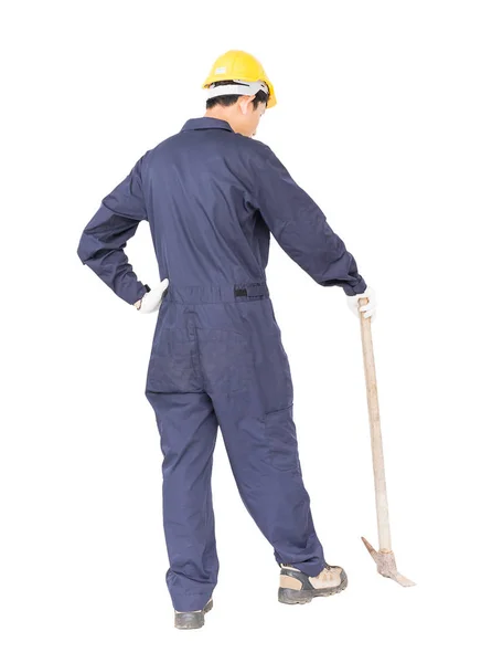 Hombre en uniforme de retención de edad recoger mattock que es un dispositivo de minería — Foto de Stock