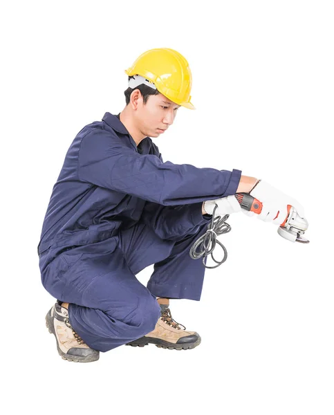 Young handyman in uniform hold grinder — Stock Photo, Image