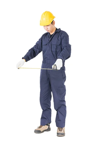 Trabajador joven en unifrom con cinta métrica en blanco —  Fotos de Stock