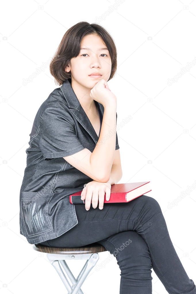  Woman reading a book sitting on chair