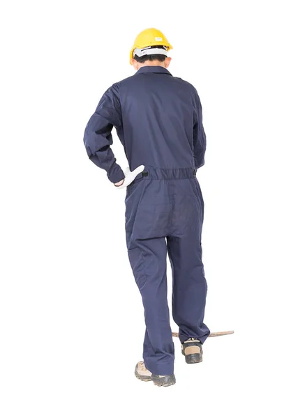 Hombre en uniforme de retención de edad recoger mattock que es un dispositivo de minería —  Fotos de Stock