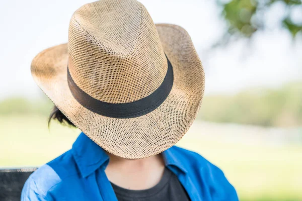 Woman wear hat sit sleep in countryside