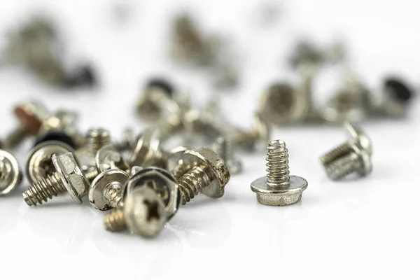 Old screws on the white background — Stock Photo, Image