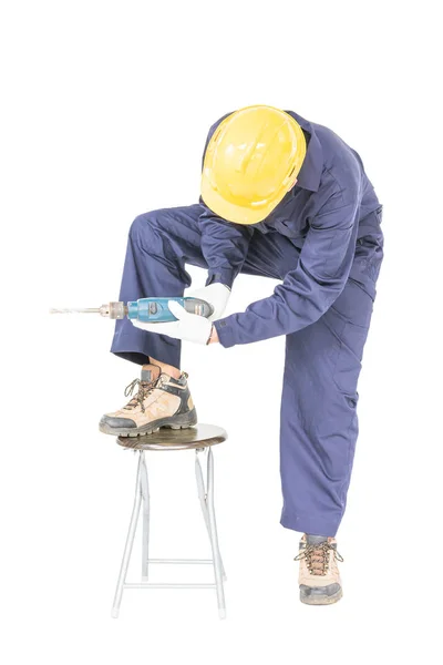 Hombre en uniforme de pie con su taladro eléctrico, recorte aislado — Foto de Stock