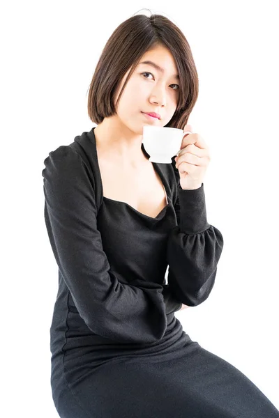 Woman holding coffee cup isolated on white — Stock Photo, Image