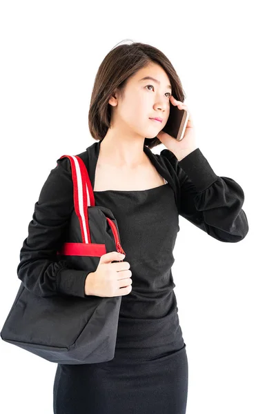 Woman carrying a black shopping bag using cellphone shopping onl — Stock Photo, Image