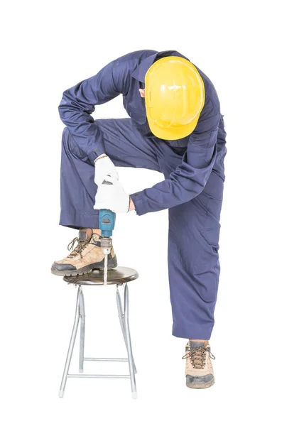 Hombre en uniforme de pie con su taladro eléctrico, recorte aislado — Foto de Stock