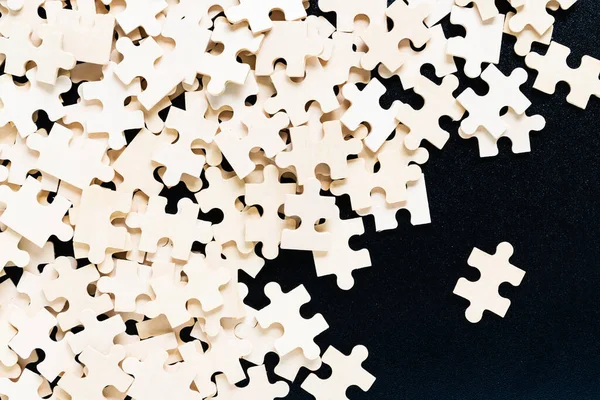 Top view Shot of wooden jigsaw puzzle pieces ,Business concept