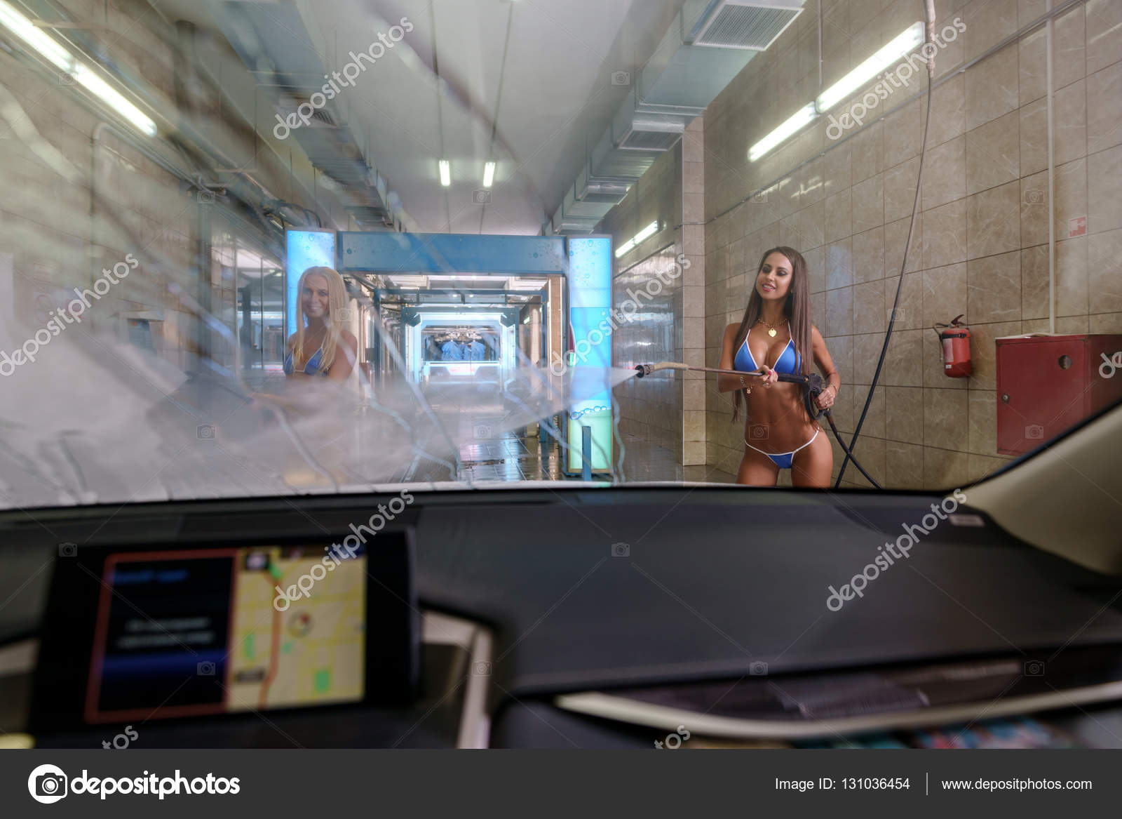 View from inside of car on girls wash windshield — Stock ...
