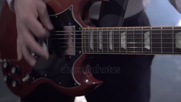 View on hands of musician playing guitar — Stock Video