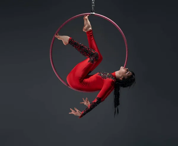 Young slim gymnast with red hoop artistic portrait — Stock Photo, Image