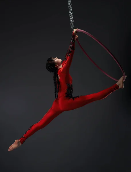 Young pretty gymnast with red hoop studio portrait — Stock Photo, Image