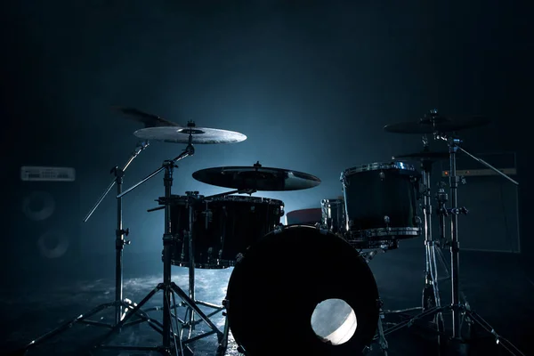 Modern drum set shot in smoky dark studio — Stock Photo, Image