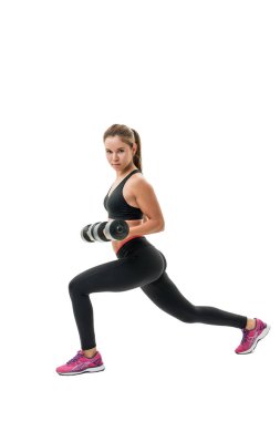 Siyah top dumbells ile güzel fitness eğitmeni