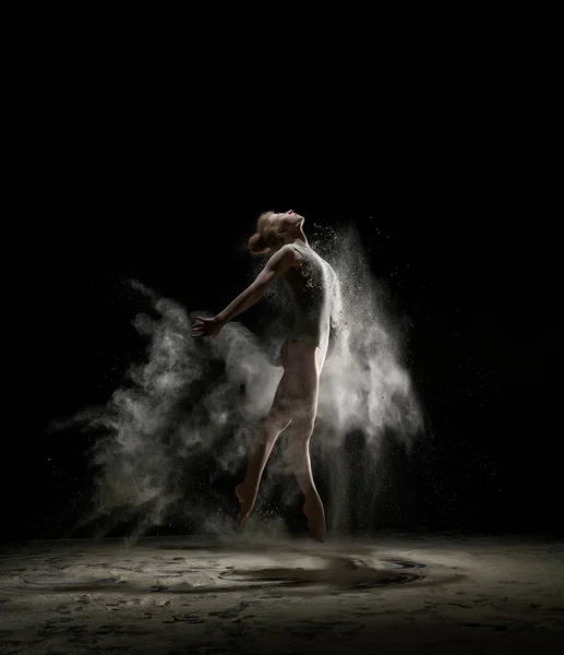 Sexy girl in a cloud of white dust studio portrait — Stock Photo, Image