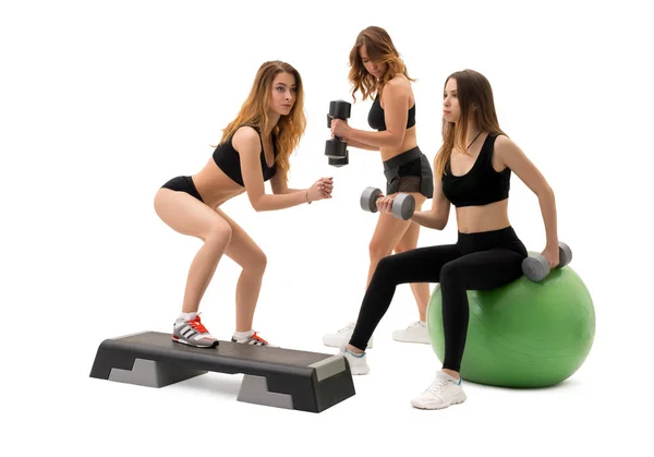 Girls with sports equipment in studio isolated shot — Stock Photo, Image