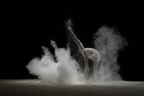 Male gymnast in white dust cloud shot — Stock Photo, Image